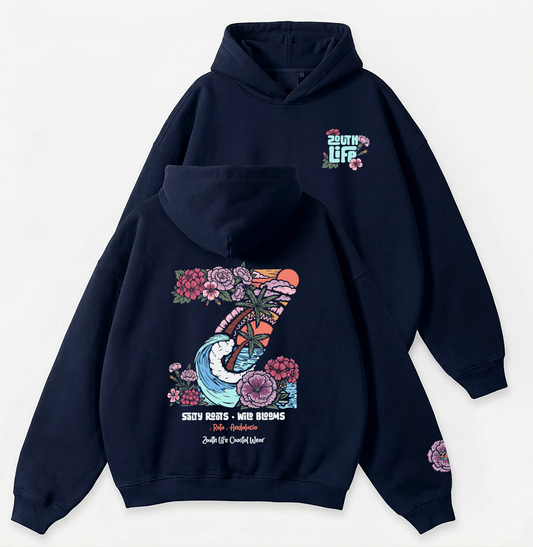 Sudadera oversize azul navy Z Wildblooms 320g Zouth Life Coastal Wear Rota Andalucía, vistas frontal y trasera sobre fondo blanco. Diseño espalda Z Wildblooms con palmera olas geranios y claveles, Detalle logo pecho y flor en manga.
